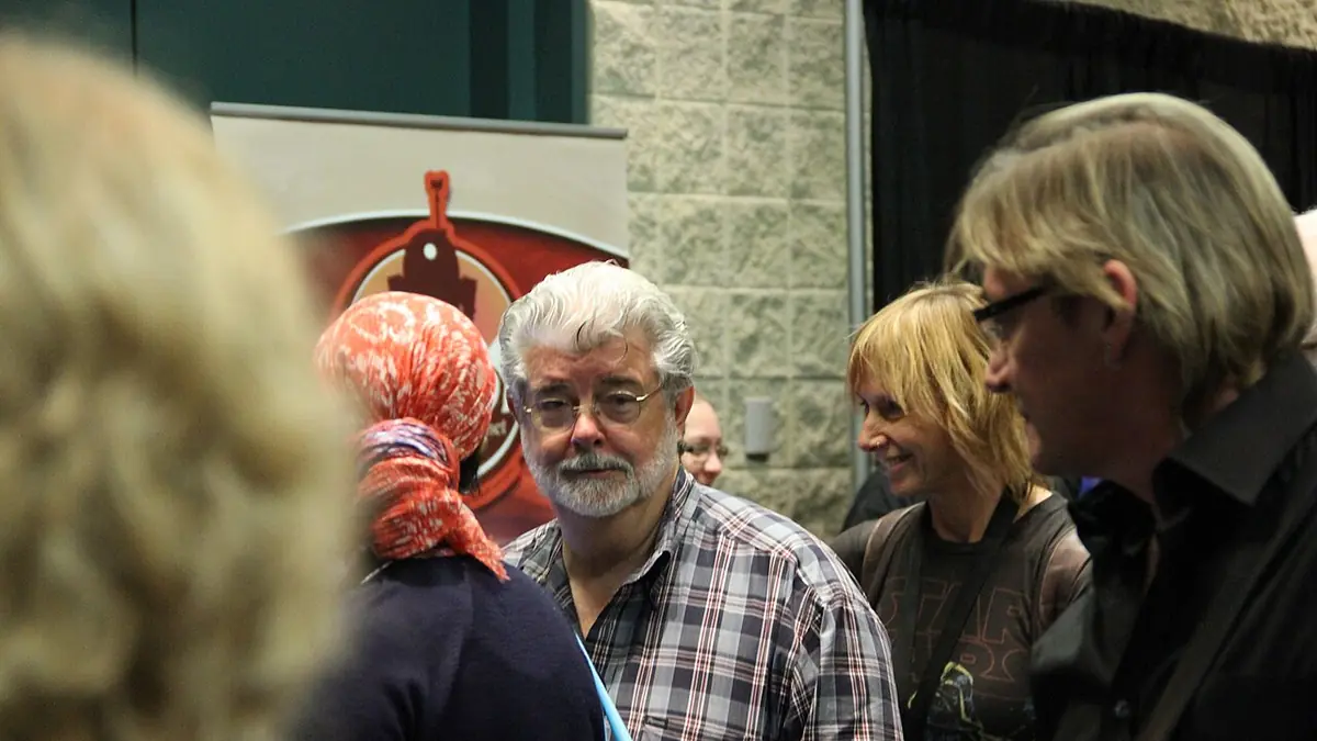 George Lucas on stage at a Star Wars convention